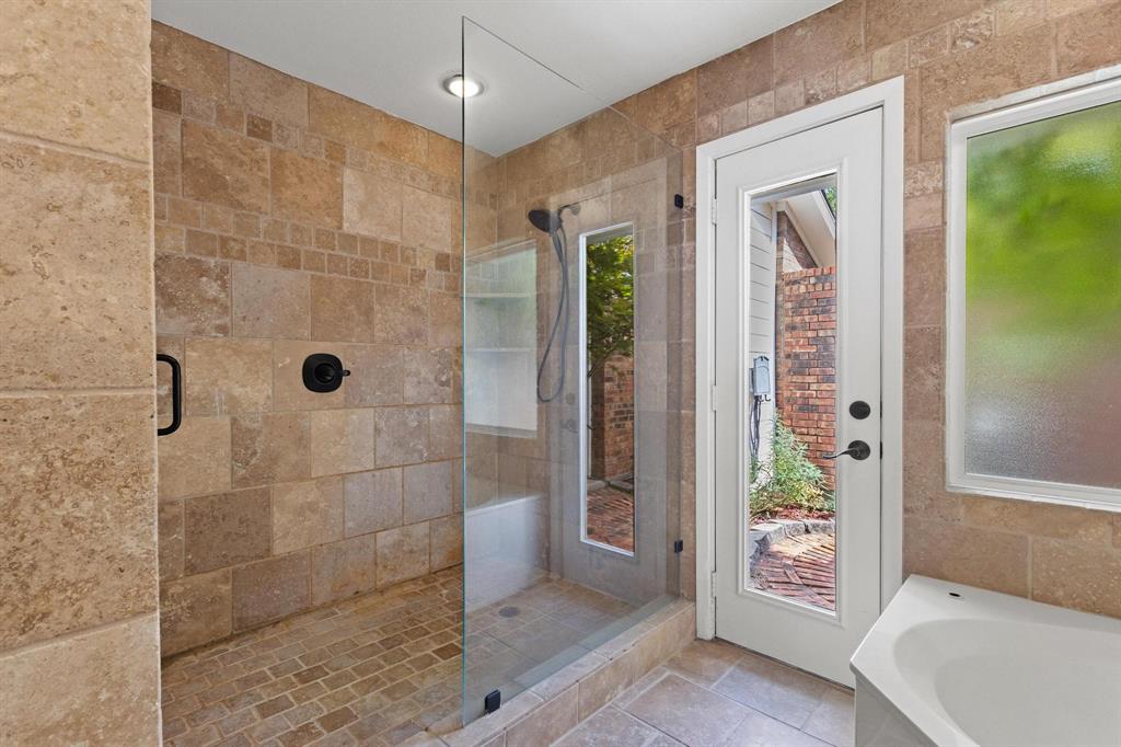 455 Lakepoint Loop Pottsboro, TX 75076 - Photo 11 of 40 Bathroom featuring tile walls, a shower stall, and a bath