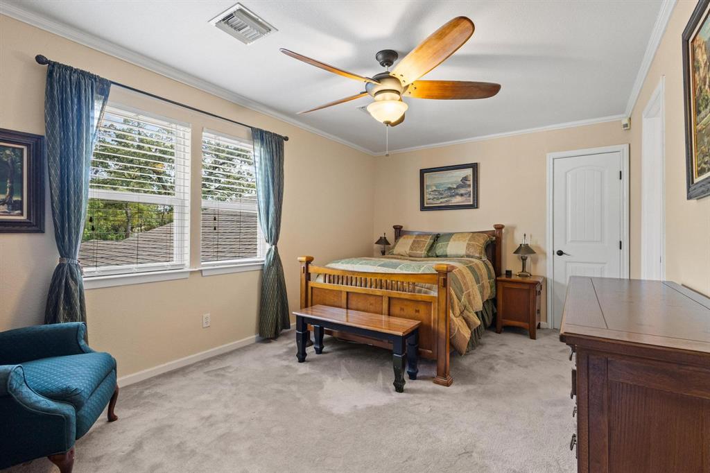 455 Lakepoint Loop Pottsboro, TX 75076 - Photo 18 of 40 Bedroom featuring crown molding, light carpet, and ceiling fan