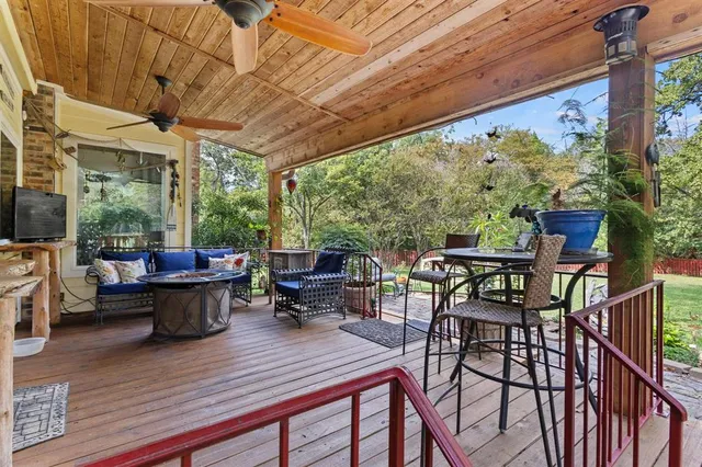 a view of a chair and tables in the patio