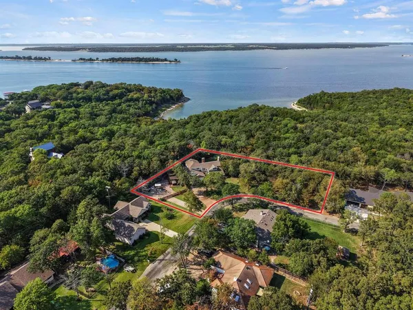 an aerial view of multiple house with yard