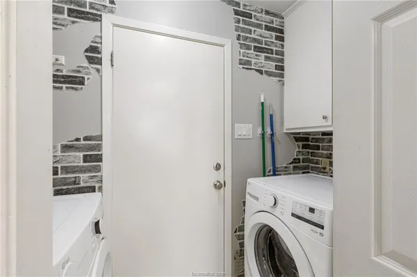 a view of hallway with washer and dryer