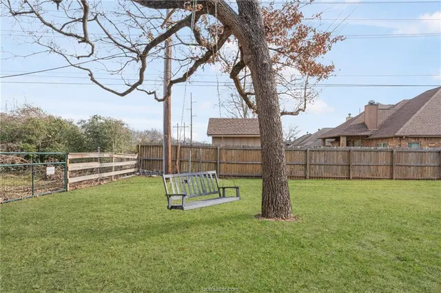 a view of backyard with green space