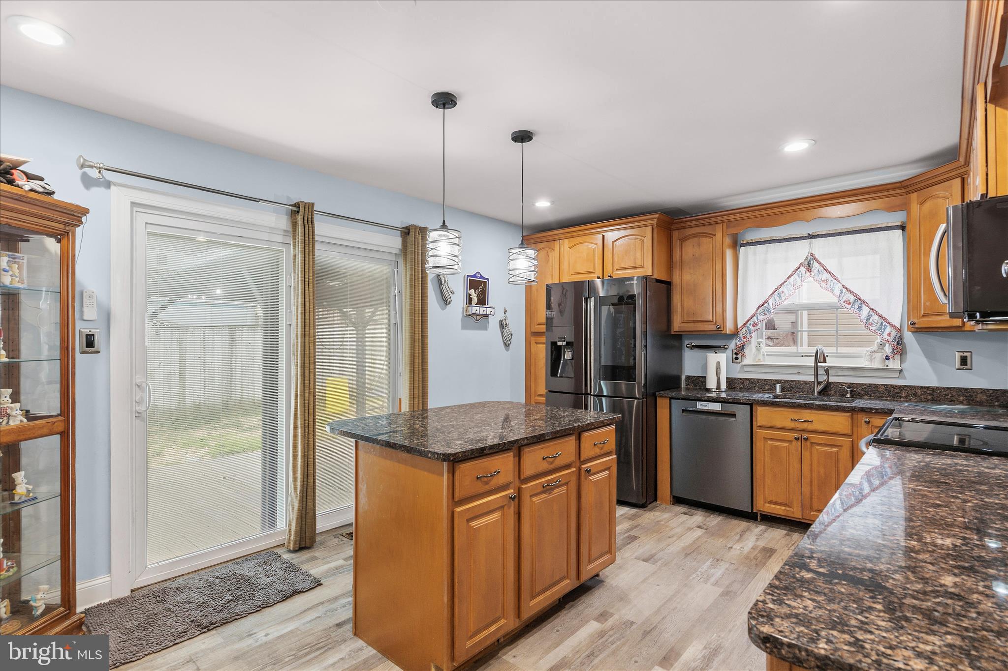 2209 227th Street Pasadena, MD 21122 - Photo 11 of 42 a kitchen with stainless steel appliances granite countertop a refrigerator and a sink