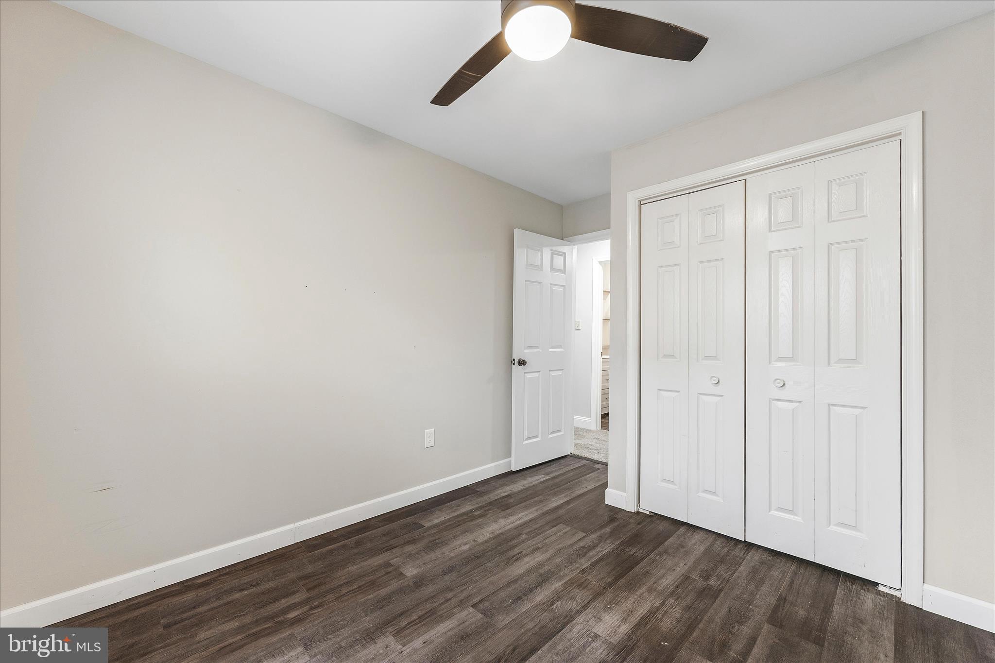 2209 227th Street Pasadena, MD 21122 - Photo 23 of 42 an empty room with wooden floor