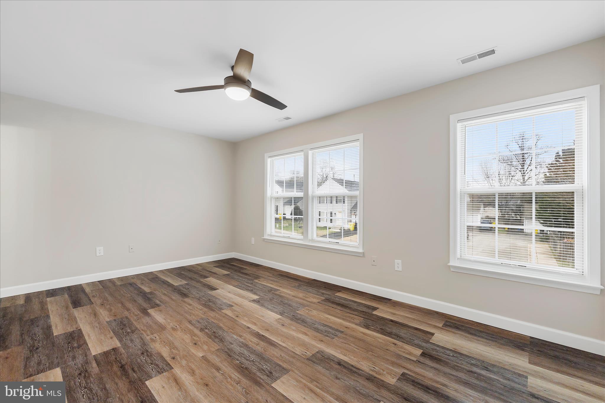 2209 227th Street Pasadena, MD 21122 - Photo 25 of 42 a view of an empty room with wooden floor and a window