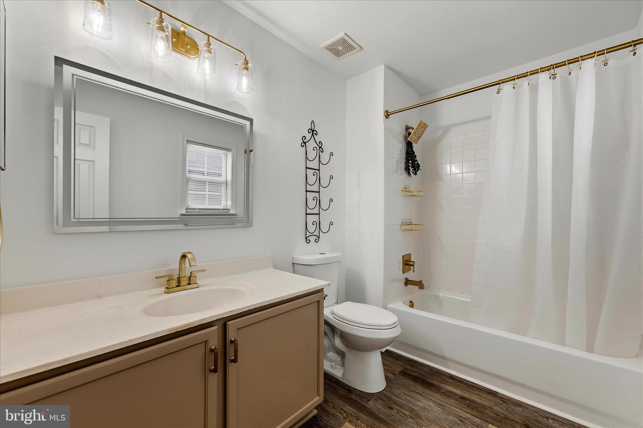 2209 227th Street Pasadena, MD 21122 - Photo 28 of 42 a bathroom with a sink a toilet and shower