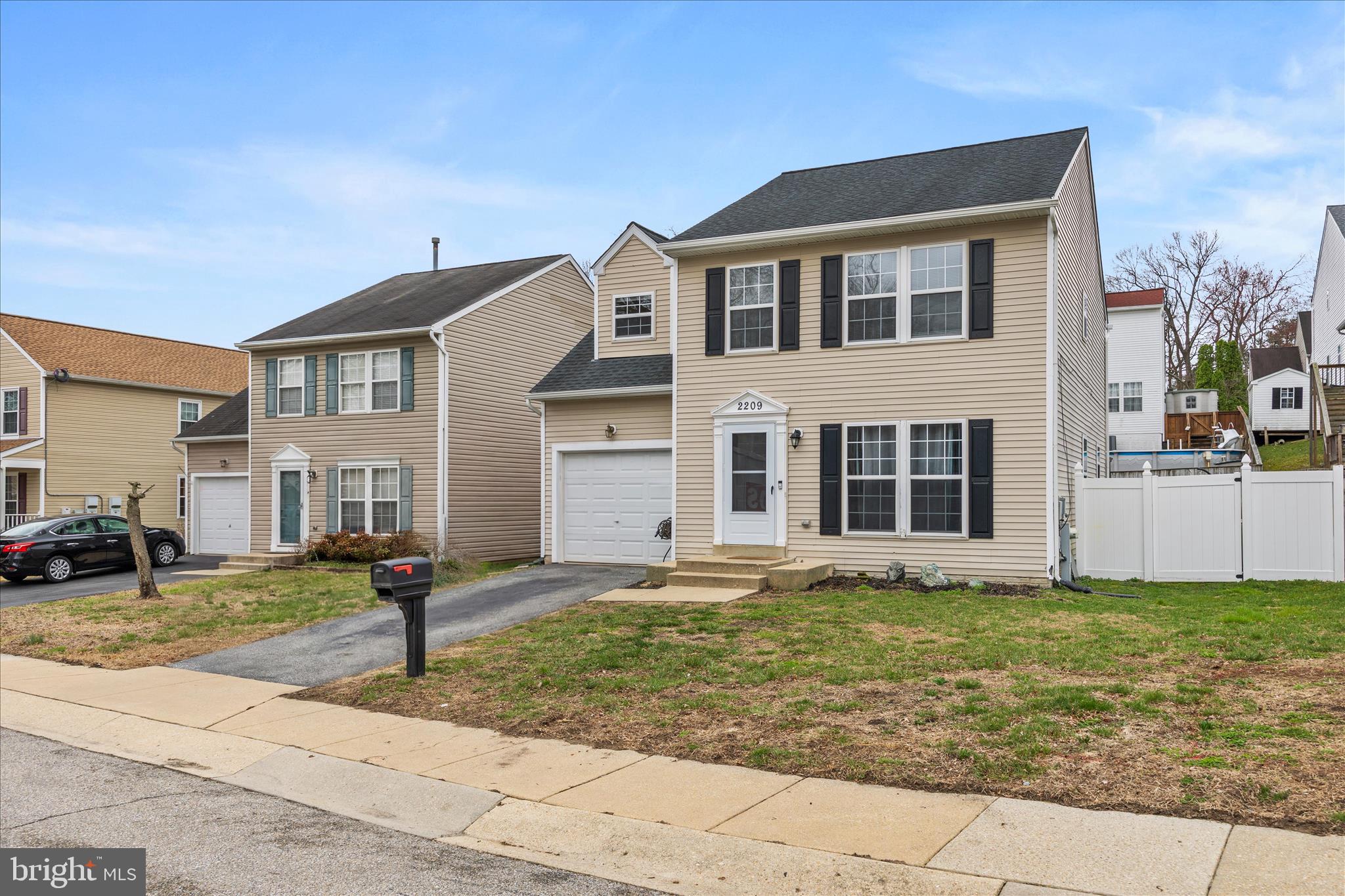 2209 227th Street Pasadena, MD 21122 - Photo 3 of 42 a front view of a house with garden