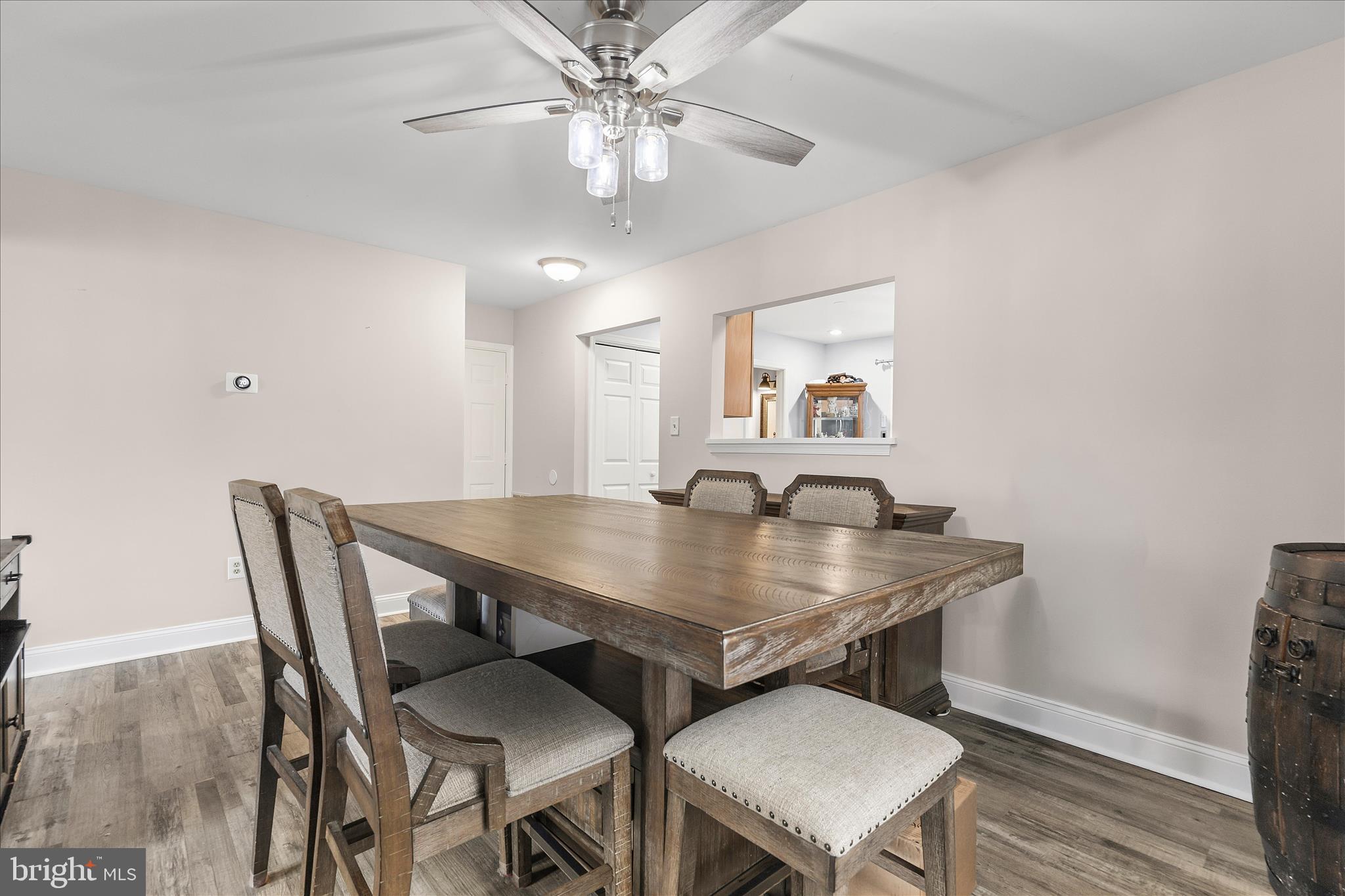 2209 227th Street Pasadena, MD 21122 - Photo 10 of 42 a view of a dining room with furniture and wooden floor