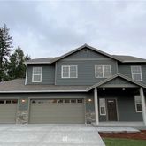 a front view of a house with garage
