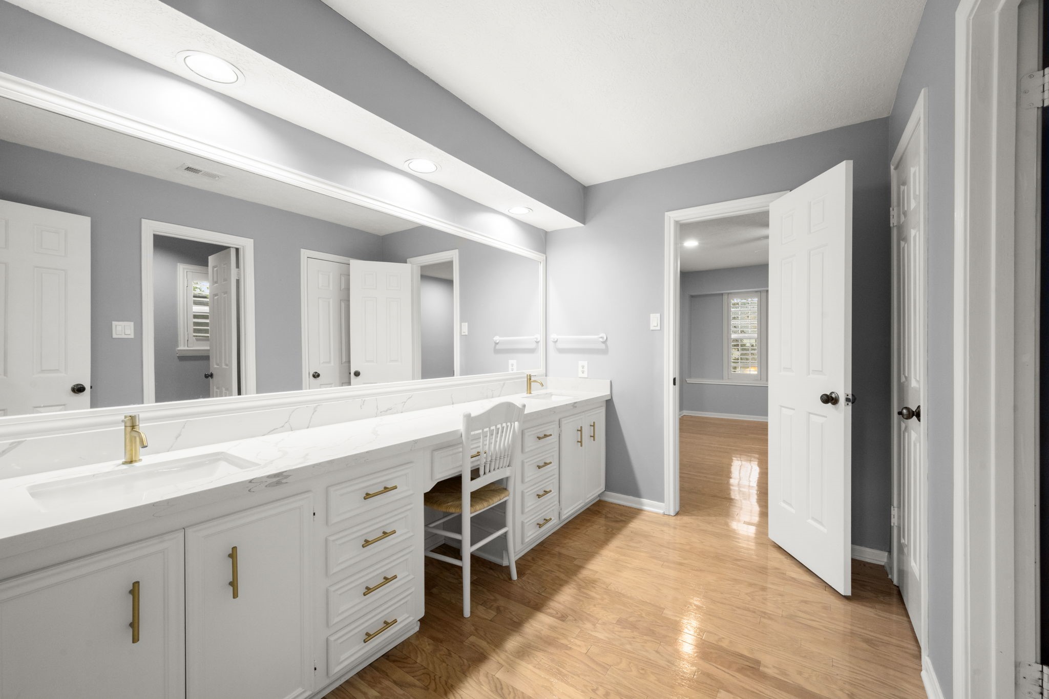 16111 Maplehurst Drive Spring, TX 77379 - Photo 19 of 30 a spacious bathroom with a double vanity sink and a mirror