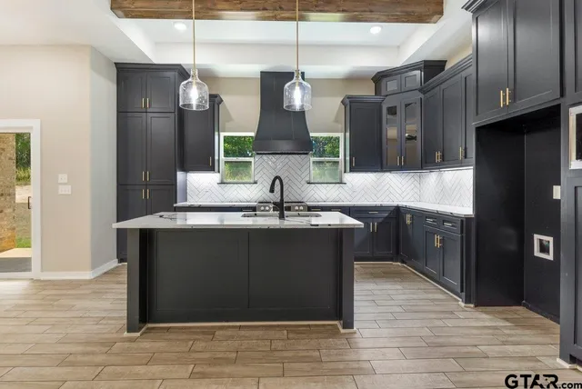 a bathroom with a sink vanity and a mirror