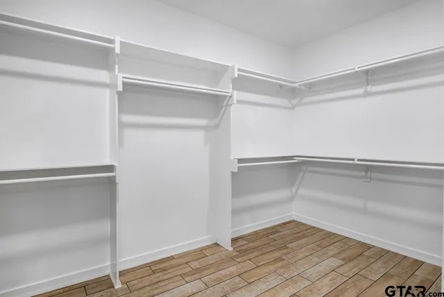 a view of an empty walk in closet