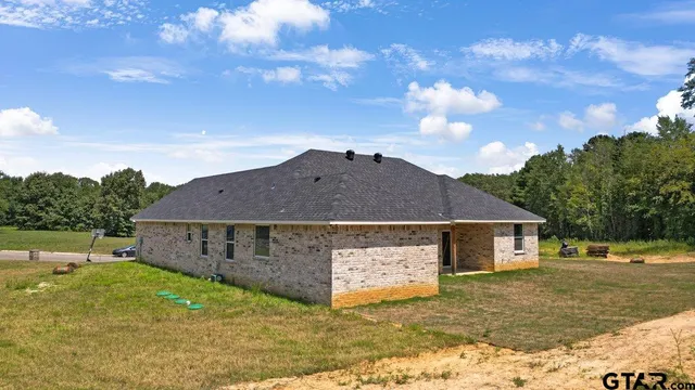 a aerial view of a house with a yard