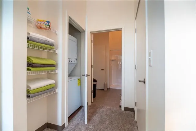 a room with a walk in closet and a bathroom