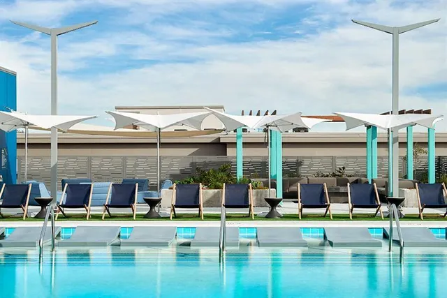 a view of a swimming pool with an outdoor seating