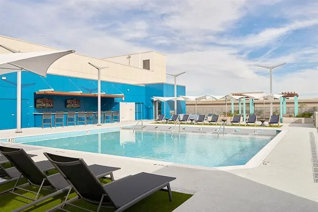 a view of a swimming pool with a lounge chairs