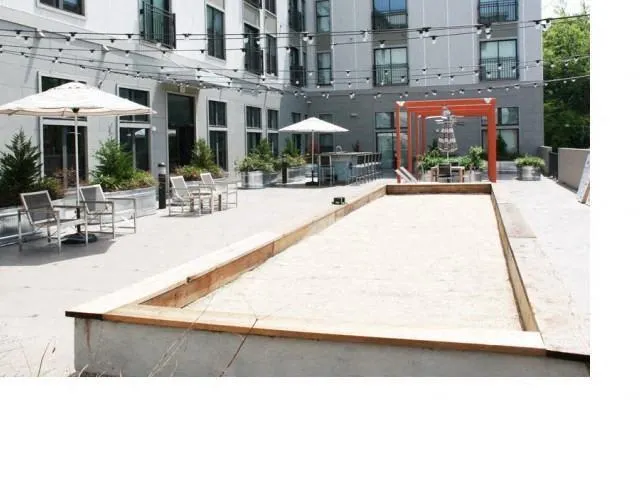 a view of a building with sitting area