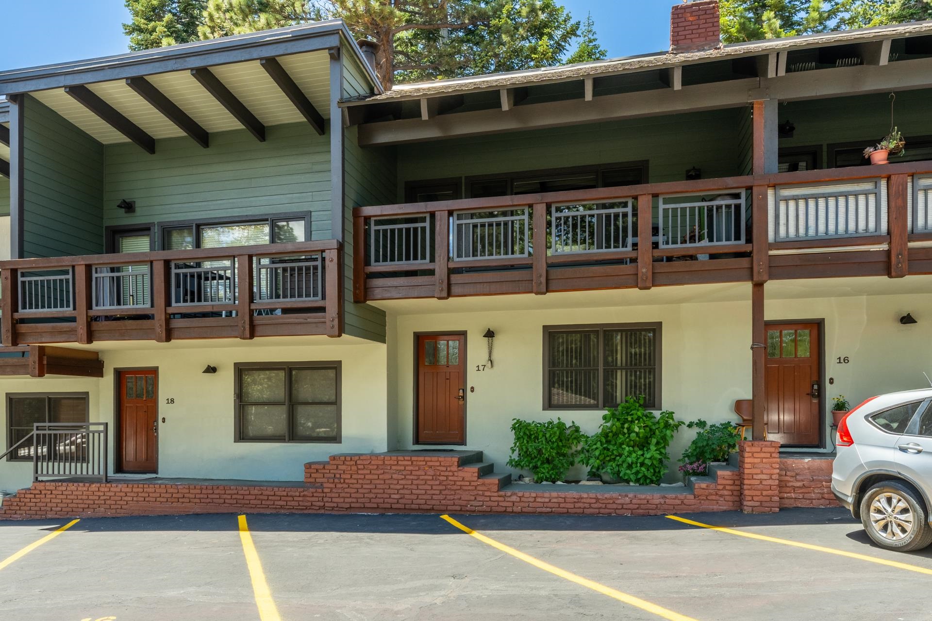 50 Hidden Valley Road, Unit 17 Mammoth Lakes, CA 93546 - Photo 1 of 40 Multi-story building featuring wood-paneled balconies and a neutral stucco facade