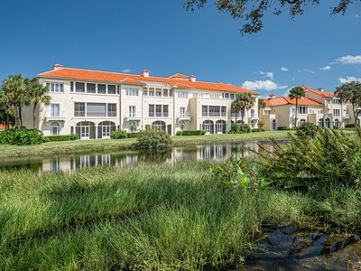 a view of a lake with a building in front of it