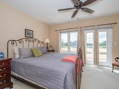 5075 Harmony Circle, Unit 302 Vero Beach, FL 32967 - Photo 15 of 32 a bedroom with a bed and window