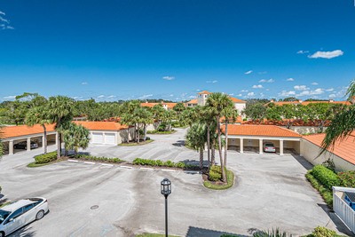 5075 Harmony Circle, Unit 302 Vero Beach, FL 32967 - Photo 24 of 32 a view of a house with patio