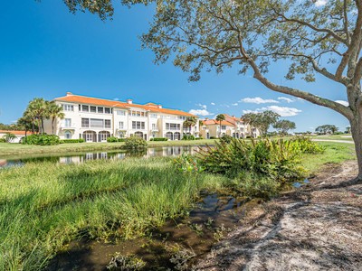 5075 Harmony Circle, Unit 302 Vero Beach, FL 32967 - Photo 31 of 32 a view of a big yard with large trees