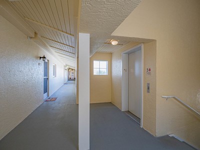 5075 Harmony Circle, Unit 302 Vero Beach, FL 32967 - Photo 4 of 32 a view of hallway with windows
