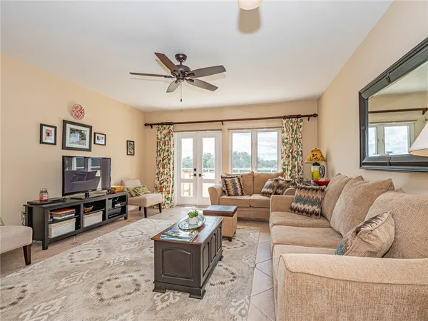 a living room with furniture and a large window
