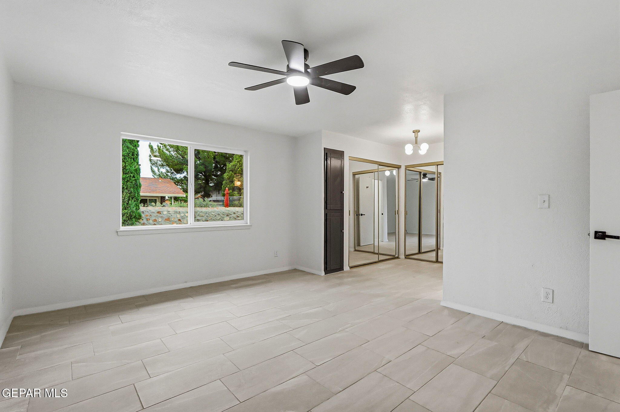 709 Frontera Road El Paso, TX 79922 - Photo 34 of 41 an empty room with fan and windows
