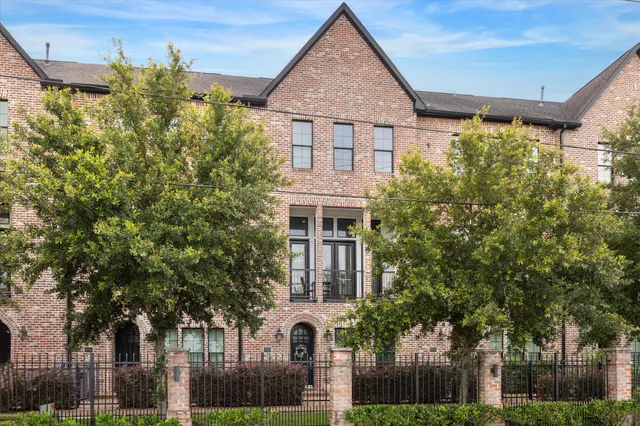 front view of a house with a tree