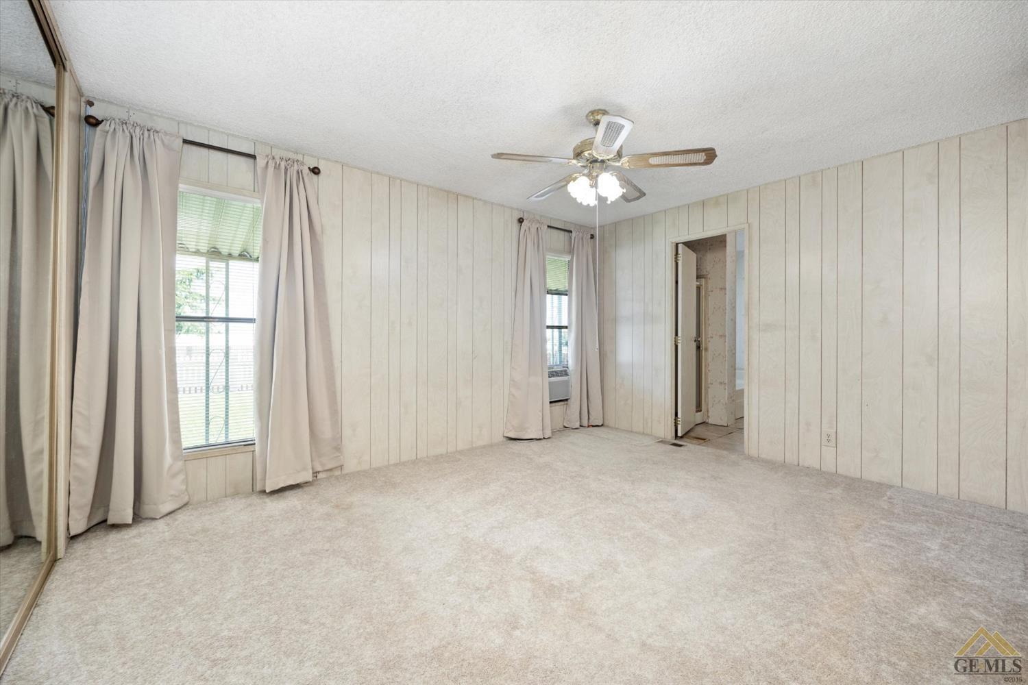 Undisclosed Address Bakersfield, CA 93306 - Photo 19 of 32 a view of an empty room with a window