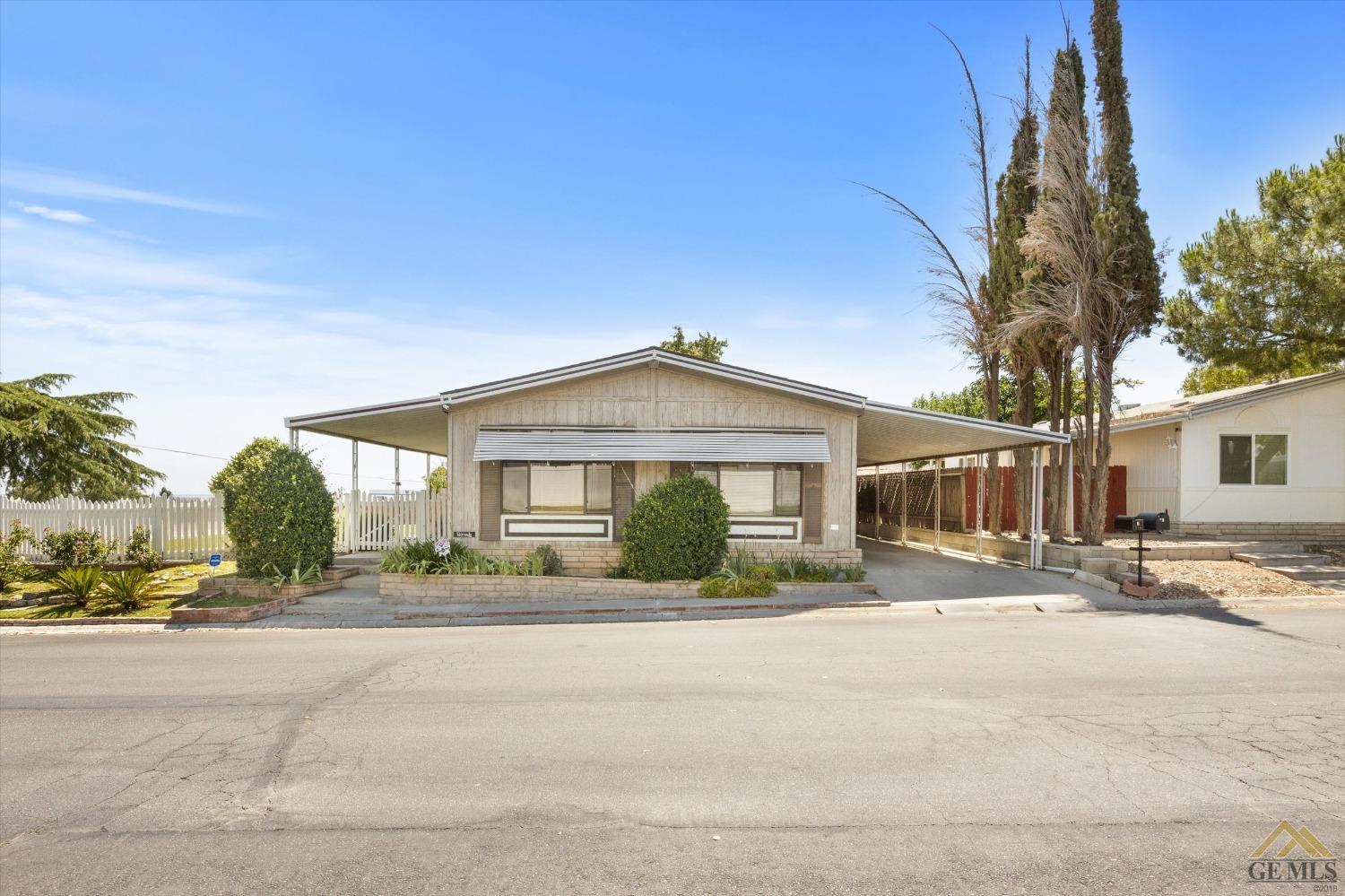 Undisclosed Address Bakersfield, CA 93306 - Photo 2 of 32 a front view of a house with a outdoor