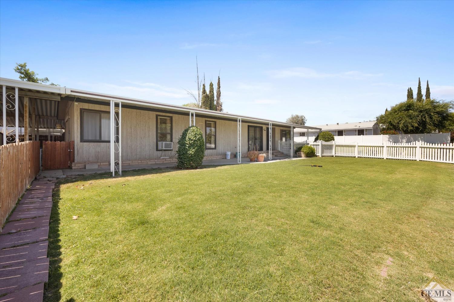 Undisclosed Address Bakersfield, CA 93306 - Photo 27 of 32 a view of a house with a swimming pool