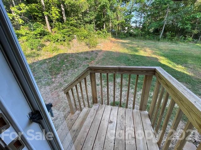 a view of balcony with yard