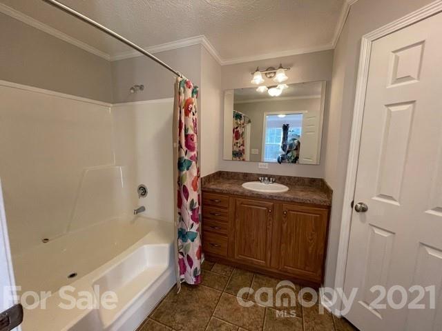284 Pearidge Road Bostic, NC 28018 - Photo 11 of 29 a bathroom with a tub sink and mirror