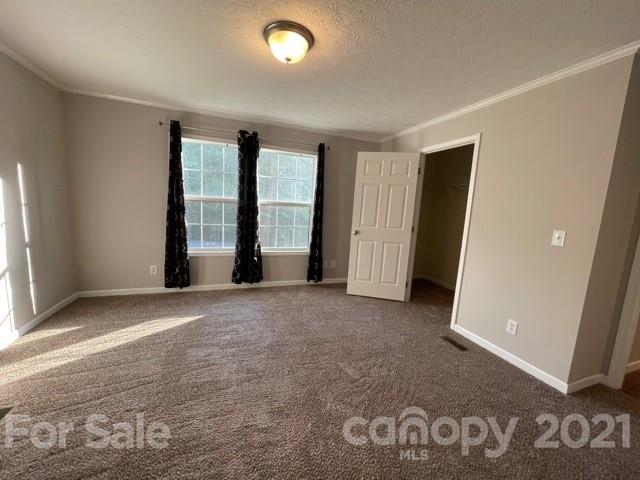284 Pearidge Road Bostic, NC 28018 - Photo 15 of 29 an empty room with windows and entrance