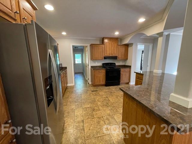 284 Pearidge Road Bostic, NC 28018 - Photo 17 of 29 a kitchen with a sink a refrigerator and a stove