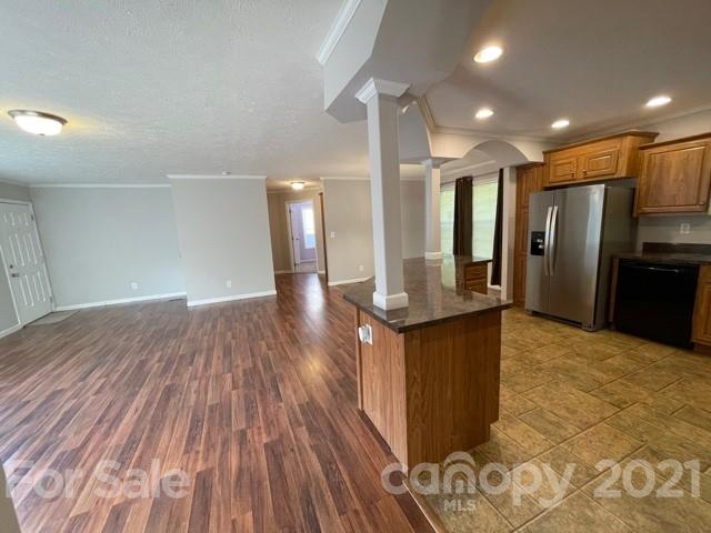 284 Pearidge Road Bostic, NC 28018 - Photo 23 of 29 a view of kitchen with refrigerator microwave and wooden floor