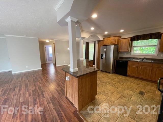 284 Pearidge Road Bostic, NC 28018 - Photo 27 of 29 a kitchen with stainless steel appliances granite countertop a refrigerator a sink a stove and oven