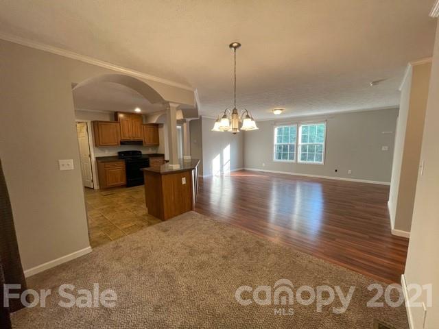 284 Pearidge Road Bostic, NC 28018 - Photo 28 of 29 a view of a room with wooden floor and a chandelier
