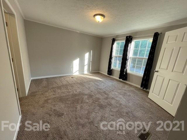 284 Pearidge Road Bostic, NC 28018 - Photo 5 of 29 a view of an empty room with glass door