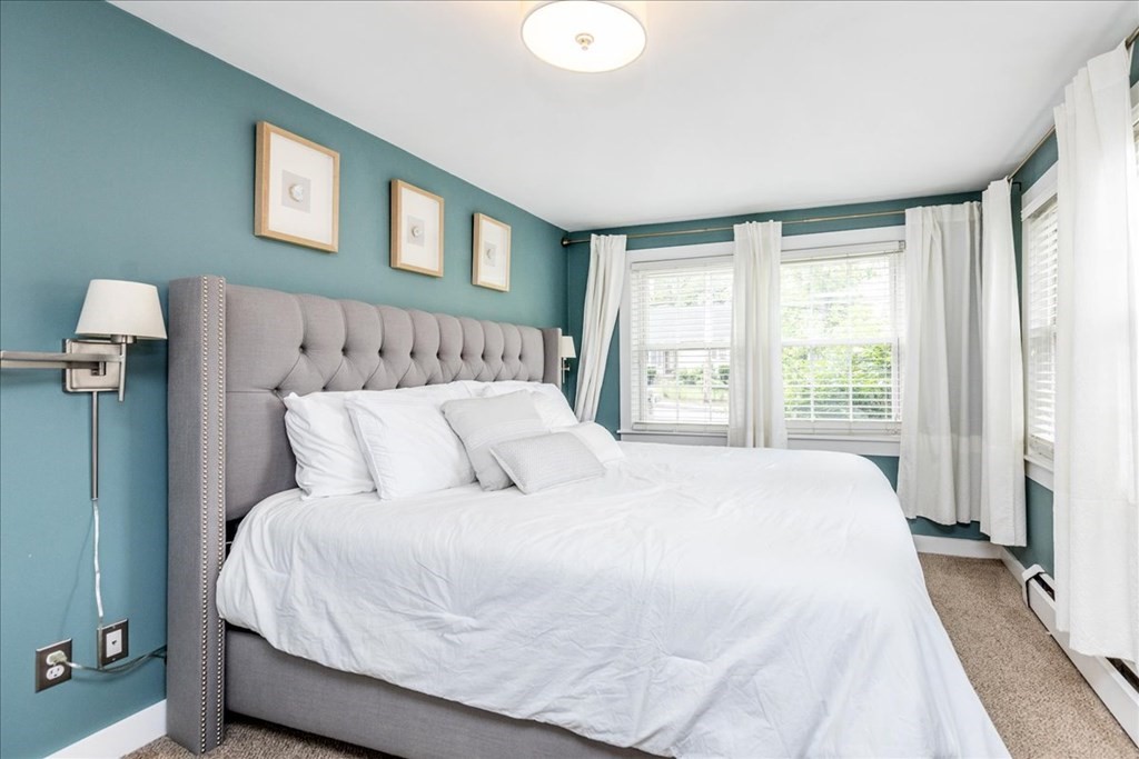 14 Francis Wyman Road Burlington, MA 01803 - Photo 18 of 39 a large bed sitting in a bedroom next to a window