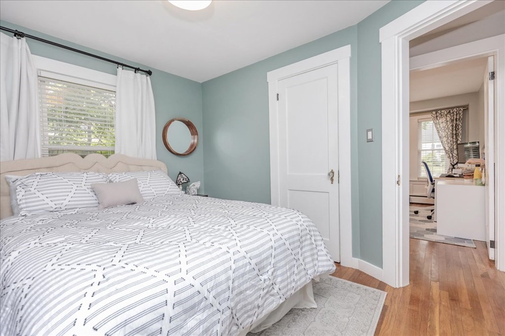 14 Francis Wyman Road Burlington, MA 01803 - Photo 27 of 39 a bedroom with a large bed and wooden floor