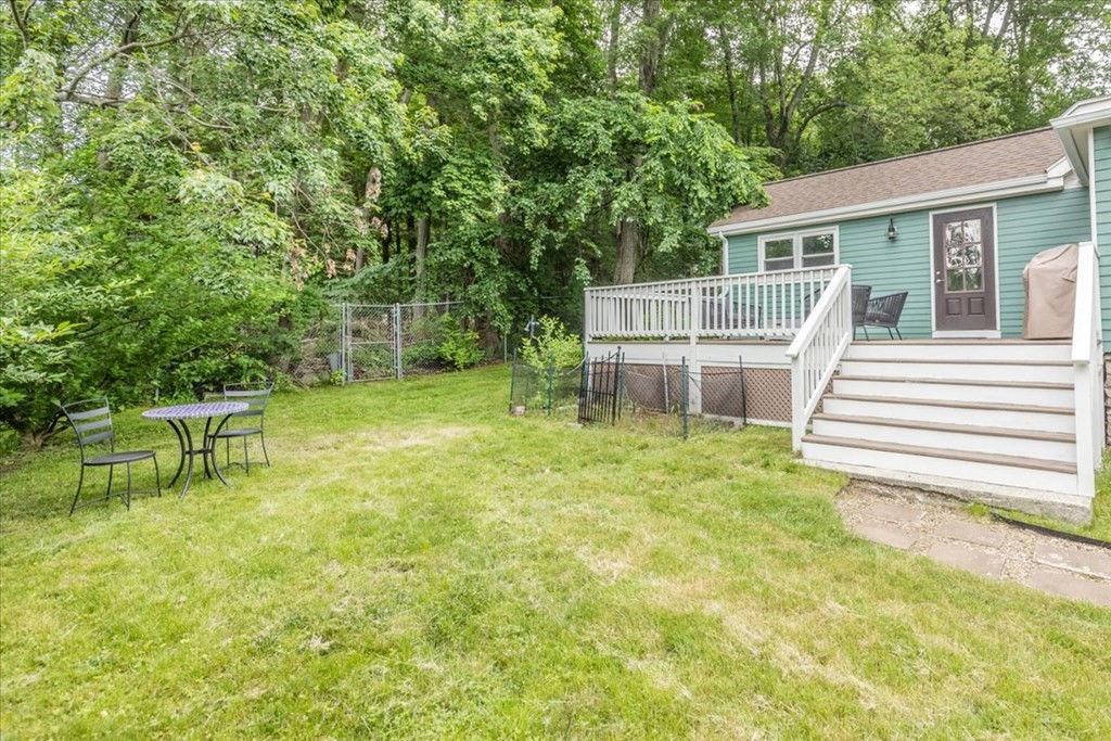 14 Francis Wyman Road Burlington, MA 01803 - Photo 33 of 39 a view of a chair and table in backyard of the house