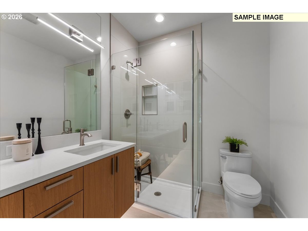 5041 Southeast King Road, Unit B Milwaukie, OR 97222 - Photo 5 of 6 a bathroom with a sink a toilet and shower