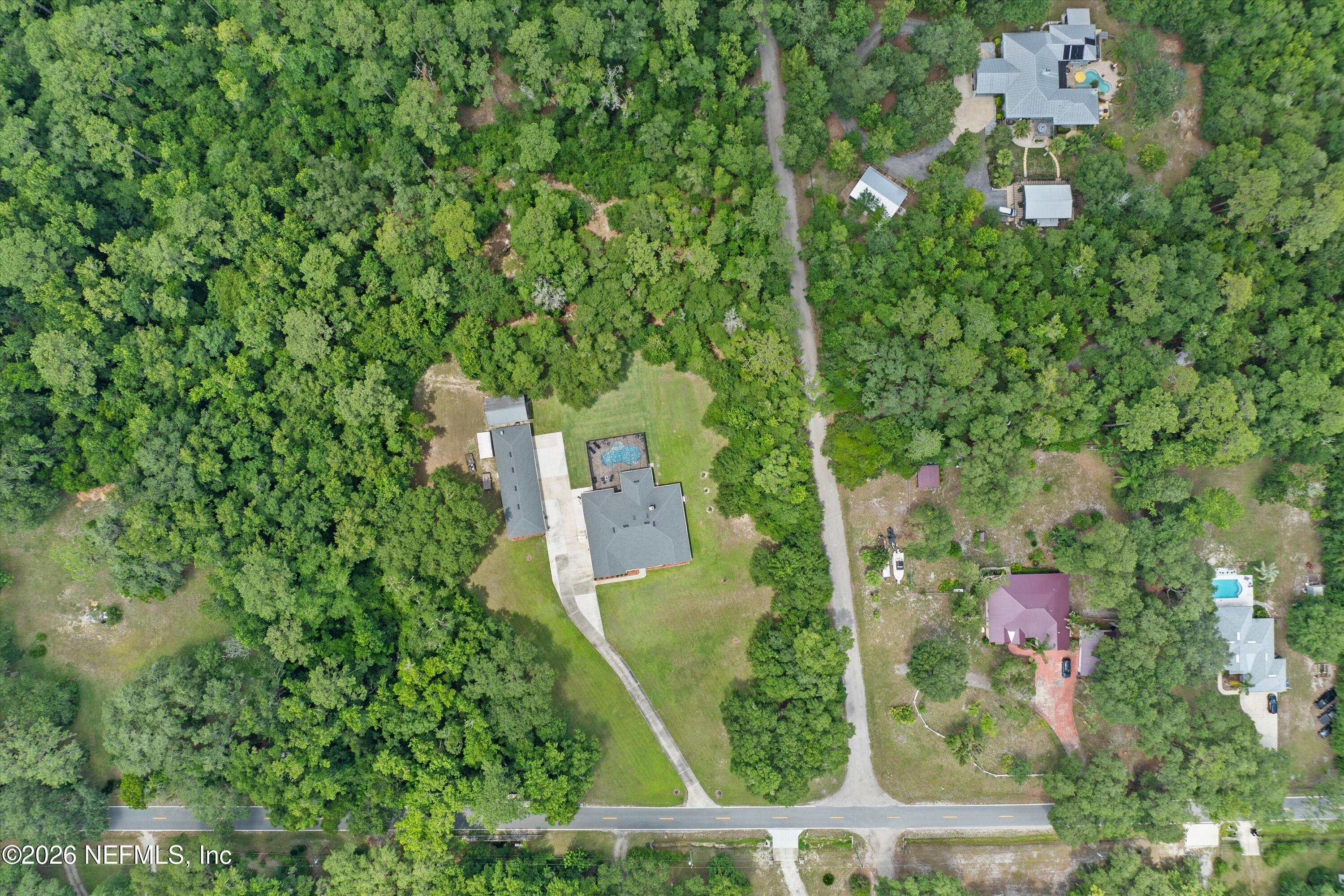 5566 Don Manuel Road Elkton, FL 32033 - Photo 47 of 47 an aerial view of residential house with outdoor space and trees all around