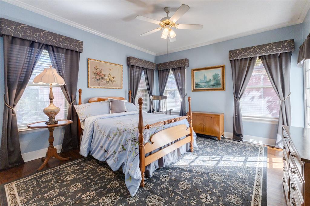 5407 Merrimac Avenue Dallas, TX 75206 - Photo 13 of 26 a bed room with a bed and a couch