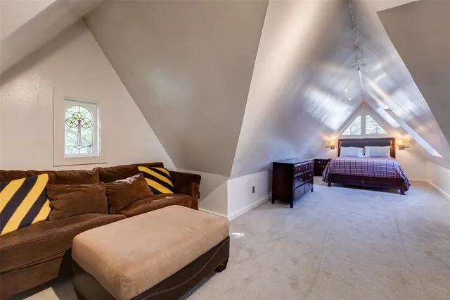 a bedroom with furniture and a window