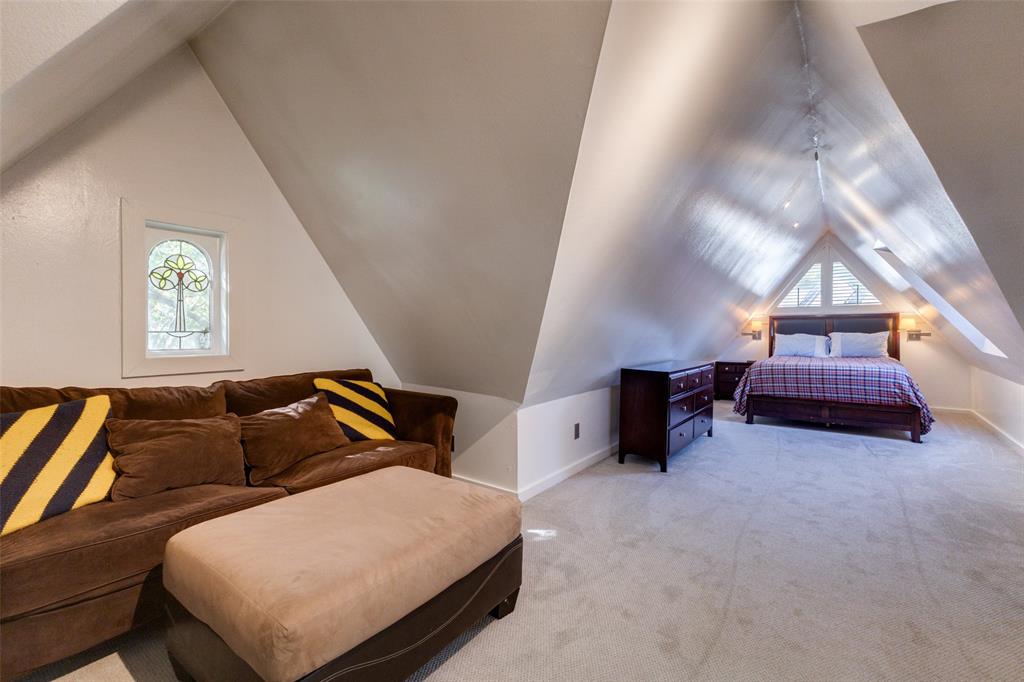 5407 Merrimac Avenue Dallas, TX 75206 - Photo 16 of 26 a bedroom with furniture and a window