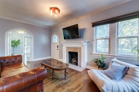 a living room with furniture fireplace and a flat screen tv